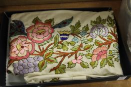 An embroidered shawl.