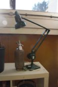 An old angle poise lamp and a soda syphon.