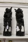 A pair of Chinese carved wood figures of Oni.