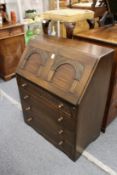 A reproduction oak bureau.
