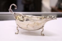 A small silver sauce boat.