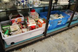 Three large boxes of Christmas decorations.