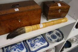 A Chinese faux bamboo handled brush.