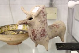 A terracotta ewer modelled as a bull.