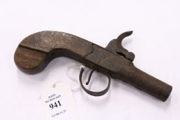 A small percussion pistol.