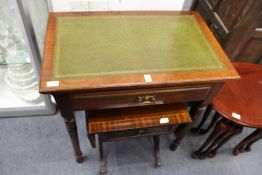 A mahogany single drawer side table with leather inset top.