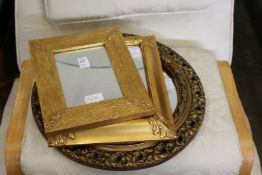 Three small gilt framed mirrors.