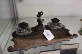 A cast iron desk stand.
