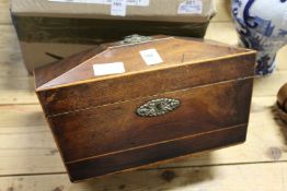 A 19th century mahogany sarcophagus shaped tea caddy.