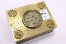 A Chinese brass box inset with carved jadeite panel.