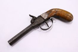 A small percussion pistol.