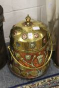 A Dutch copper and brass lidded coal box.