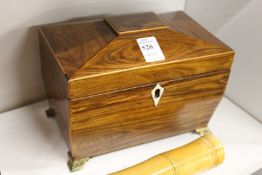 A good 19th century sarcophagus shaped twin division tea caddy with ormolu feet.