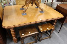 An early 20th century Indian rosewood extending dining table with one leaf.