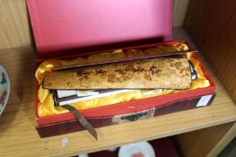 A modern Chinese scroll in a fitted box.