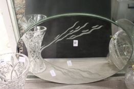 An etched mirrored oval stand.