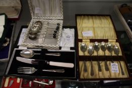 Two cased sets of silver coffee spoons and a christening set.