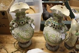 A pair of decorative continental pottery vases.