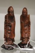 A pair of Chinese carved wood figures of sages.