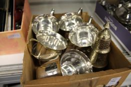 A quantity of plated cups and a sugar sifter.