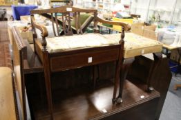 A mahogany music seat and a cabriole legged stool.