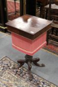 A 19th century mahogany work table, probably Isle of Man, with rising top, fitted interior,