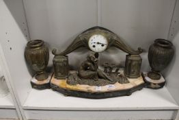 An Art Deco clock garniture.