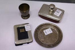A silver blotter, a small photograph frame, egg cup and dish.