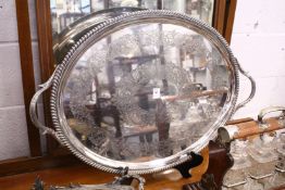 A good large twin handled oval plated tray with engraved decoration.