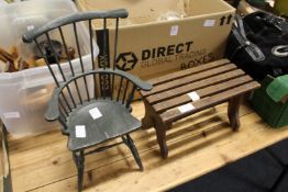 A miniature painted Windsor chair and a miniature slatted wood bench.