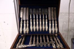 A good set of eighteen dessert knives and forks in a fitted case.