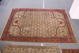 A good early 20th century Persian carpet, beige ground with stylized geometric decoration (please