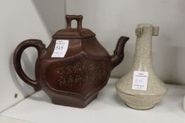 A Chinese Yixing teapot and a small bottle vase (AF).