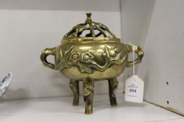 A Japanese brass censer.