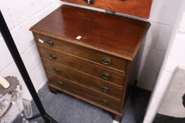 A small mahogany four drawer chest.