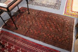 A small Persian style Bokhara rug.