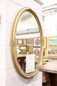 A good oval gilt framed mirror with reeded frame.