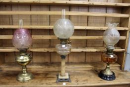 Three decorative oil lamps.