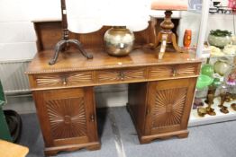 An early 20th century Indian rosewood sideboard with galleried back, three frieze drawers and
