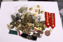 A large quantity of military buckles, badges etc.