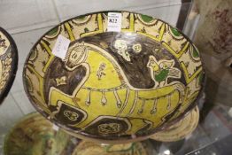An early Islamic painted pottery bowl.