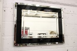 An Art Deco style rectangular wall mirror.