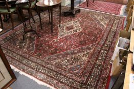 A large Persian style carpet.
