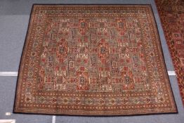 A machine made Persian style carpet.