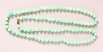 A CHINESE JADEITE BEADED NECKLACE, each bead approx. 7mm.