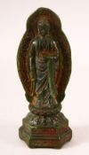 A CHINESE CARVED JADE FIGURE OF BUDDHA, stood upon lotus formed base with halo, 20cm high.