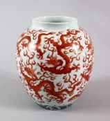 A CHINESE FAMILLE ROSE DRAGON JAR, painted with red dragons and with wave decoration to lower, the