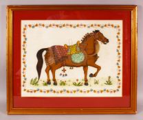 AN INDIAN PAINTING OF A HORSE ON SILK, with a floral border, framed and glazed, overall 55cm x