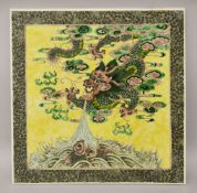 A SUPERB LARGE CHINESE FAMILLE VERTE PORCELAIN PLAQUE, painted with a dragon and carp on yellow