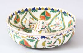 A TURKISH KUTAHYA POTTERY LEMON SQUEEZE - decorated with floral motifs, 18cm